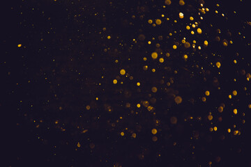 Golden bokeh of lights with black background