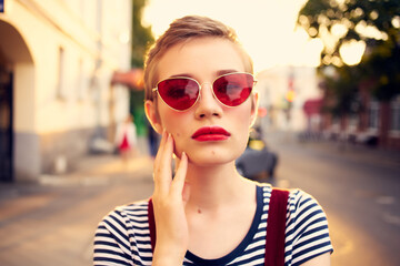 Fototapeta na wymiar woman in sunglasses with short hair outdoors romance posing