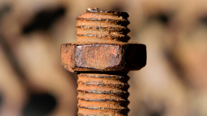 old rusty bolt, iron rod with screw threads. Rusted mechanical components. threaded bolt and nut isolated close up. dismantling concept, difficult to unscrew, non-removable. selective focus