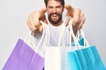 man with bags in his teeth shopping lifestyle fun