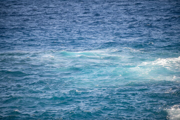 Abstract sea nature background. Water waves in sunlight with copy space. Tropical beach. Watering place. Aqua sea water surface.
