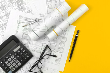 House designing and architect plan concept. Drawing sketch plans blueprints on office table desktop, top view photo