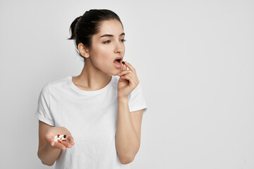 woman with pill in hands treatment health medicine health problems