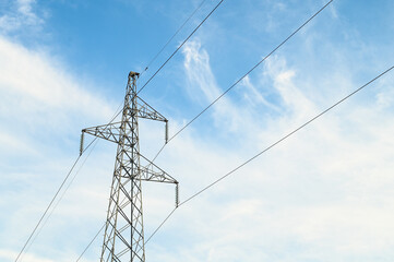 High voltage transmission power towers. Electricity pylon tower and power lines at sunset. Electric Power Station. 