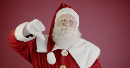 Unhappy Santa Claus showing thumb down.