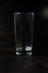 empty tall glass cup on a dark background