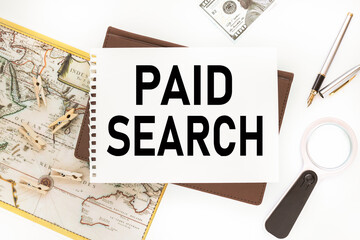 PAID SEARCH, Text on white paper that lies on the diary