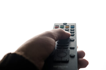 Hand holding tv remote isolated on white background.