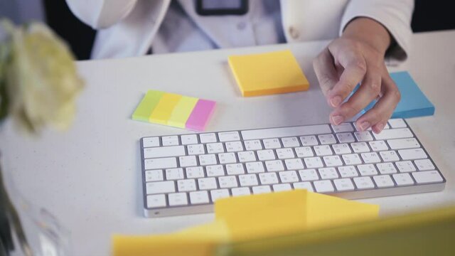 salary employee working at her desk in the office during office hours.