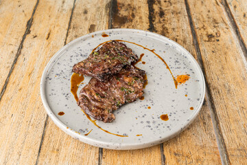 Meat steak on wooden table
