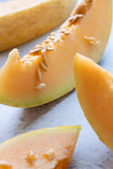 Fresh melon sliced on table,  raw ripe biological fruit, food background