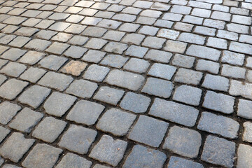 Close-up on the road in the old part of the city, background.