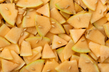 Close up of fresh melon sliced on table,  raw ripe biological fruit, food background