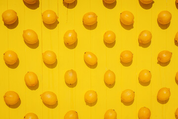  juicy lemons on bright yellow background