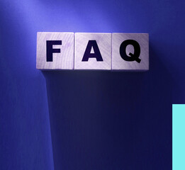 FAQ text on wooden cubes on red. Frequently Asked Questions. Business concept
