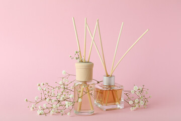 Aromatic concept with diffusers on pink background