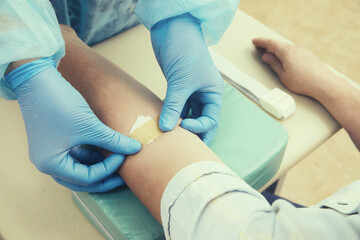 Nurse taking blood sample to make a test in laboratory