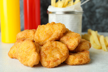 Concept of fast food on white textured table