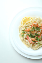 Concept of tasty eating with shrimp pasta on white background