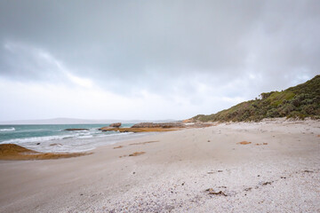 Beach scene on overcast day along the Great Ocean Road at Portland, Victoria Australia