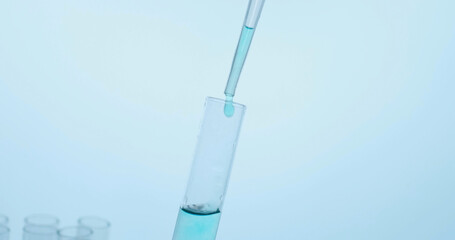 Hand of scientist holding flask with lab glassware and test tubes in chemical laboratory. Science laboratory research and development concept. Corona Virus.