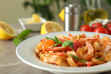 Concept of cooking shrimp pasta on gray textured table