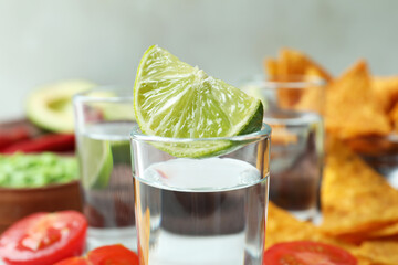 Party concept with tequila, guacamole and chips