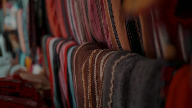 Handmade Guatemalan Textiles In The Souvenir Shop Near Antigua, Guatemala, Central America - rack focus