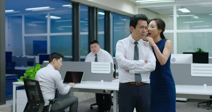 Young businesswoman telling secret to manager,4K