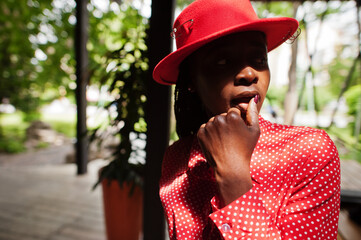 Pretty braids business african american lady bright bossy person friendly wear office red shirt and hat.