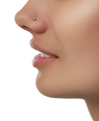 Young woman with nose piercing on white background, closeup