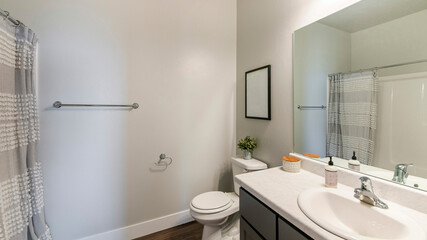 Pano Bathroom interior with wooden flooring and vanity sink