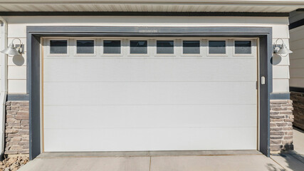 Pano Exterior of a garage of a house with stone bricks walls and windows