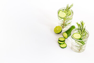 Lemonade with cucumber lime and herbs in glasses