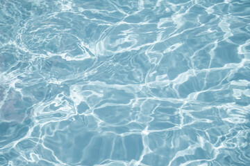 Crystal clear blue water in swimming pool. Abstract background