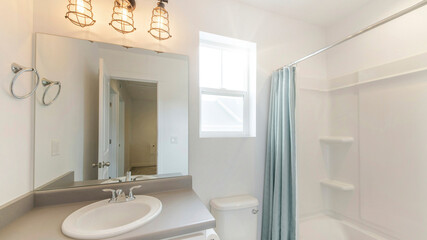Pano Small and simple bathroom interior with vanity and window