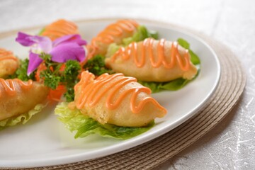 Deep fried bean curd pipa tofu with Chef special salad sauce on white background Asia halal menu