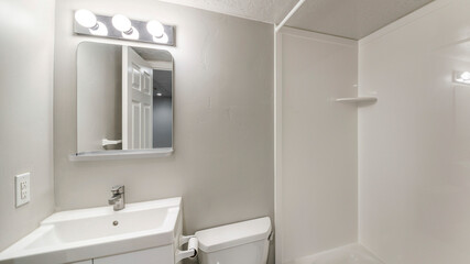 Fototapeta na wymiar Pano Small all white bathroom interior with vanity sink and mirror