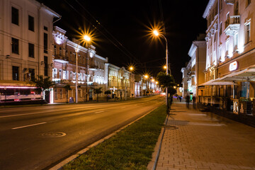 Fototapeta na wymiar street of the night city in the light of lanterns