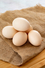 organic eggs on burlap fabric