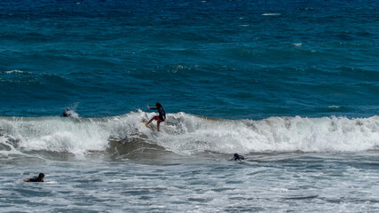 Surfing in Las Canteras Beach, in Las Palmas City