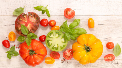colorful tomatoes and basil- top view