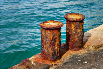 Corrosion of metal. Rusty bollard.