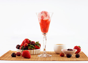 ice cream flavored red fruits in the bowl with ingredients in the decoration