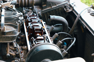 Car repair. Internal combustion engine repair. Deposits of tar from low-quality oil on the engine timing mechanism. Close-up view.