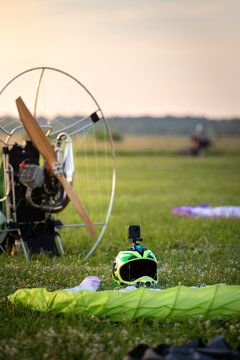 A male pilot is preparing a gasoline-powered paralet for flights. Paragliding for individual paragliding flights. Preparation for wing flight. Extreme sports.