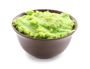 Bowl with tasty guacamole on white background