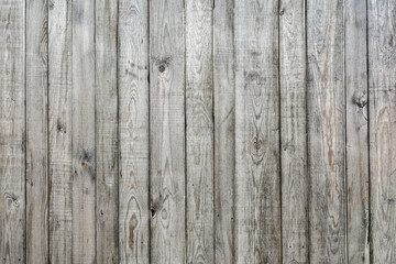 The texture of an old weathered wooden fence. Pattern and natural wood background.