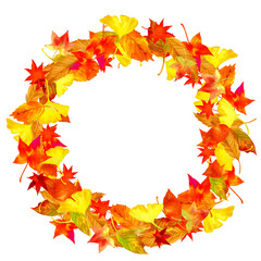 A round frame made of autumn leaves