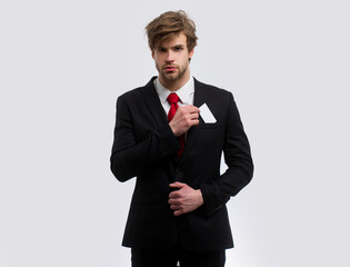 Business man with credit card. Portrait of young businessman, isolated on white background. Business success concept.